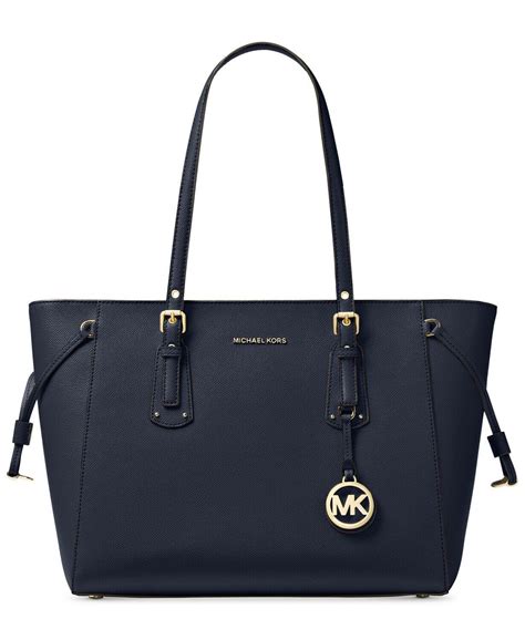 michael michael kors signature voyager multi function top zip tote|Michael Kors voyager tote merlot.